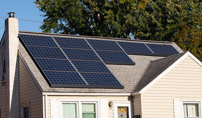 A house with solar panels on the roof, featuring "Solar snap," "solar protectant," and "environmental guard" technology.